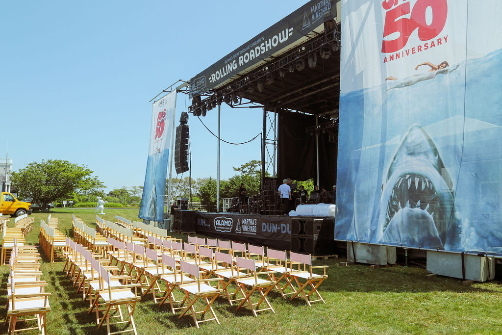 VIP lounge furniture setup overlooking the outdoor screening area at the JAWS anniversary event on Martha’s Vineyard.