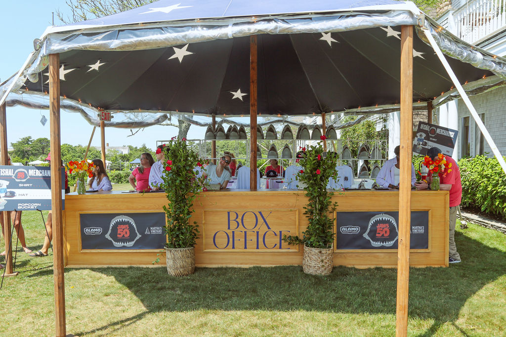 Box office and guest check-in area using bar and shelving furnishings from Kadeema Rentals at the JAWS 50th anniversary screening on Martha’s Vineyard.